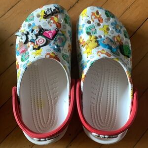 Lot of 3 Pairs of J4 Used Crocs, one pair is Gray and two pairs are Pokémon